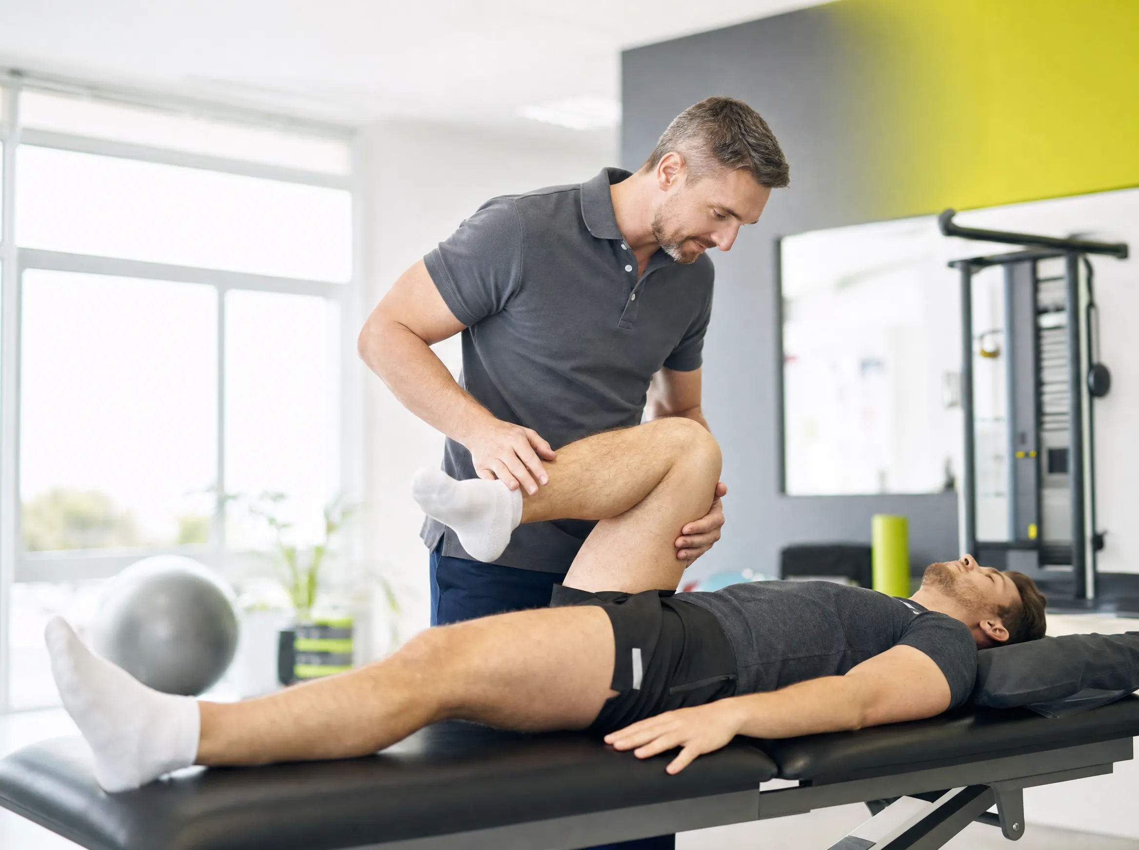 Physiotherapist’s hands performing manual therapy on a patient’s knee at Easthill Physiotherapy